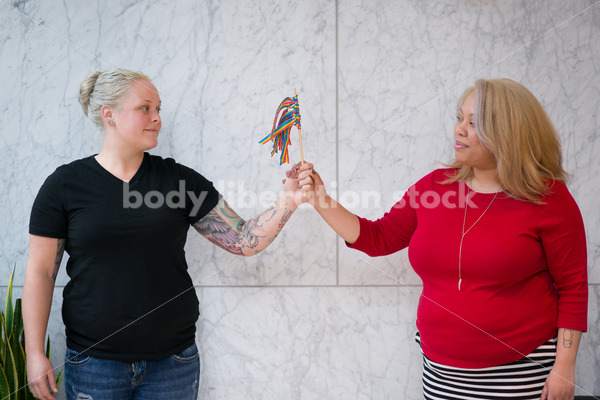 Human Rights & LGBT Stock Photo: Lesbian Couple with Rainbow Ribbon Flag - Body Liberation Photos